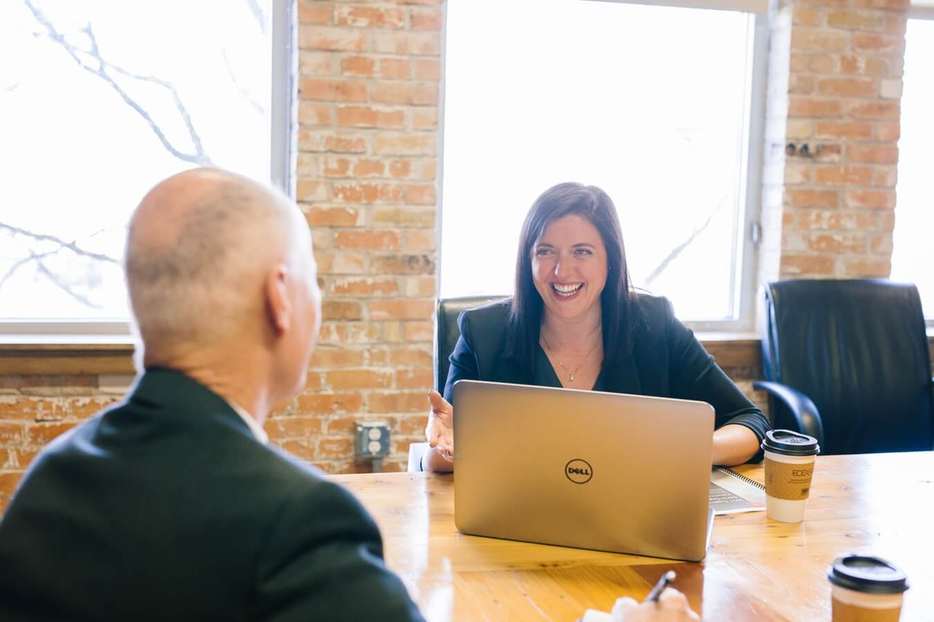 Woman discusses with man